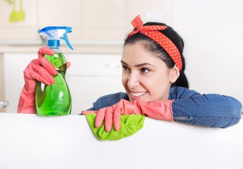 Technician preparing carpet cleaning equipment with attention to workplace safety